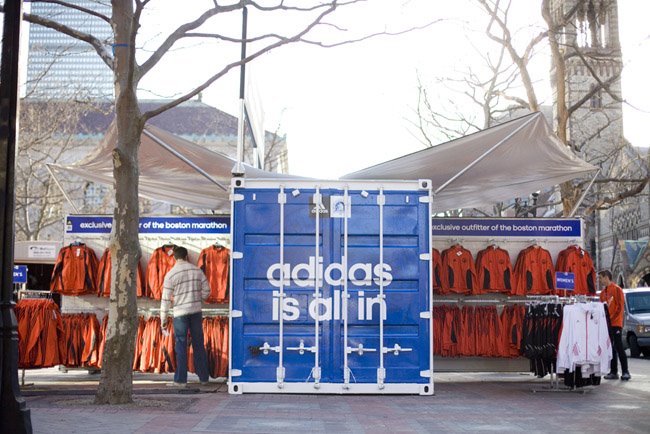 Adidas branded pop-up retail container operating at a public event