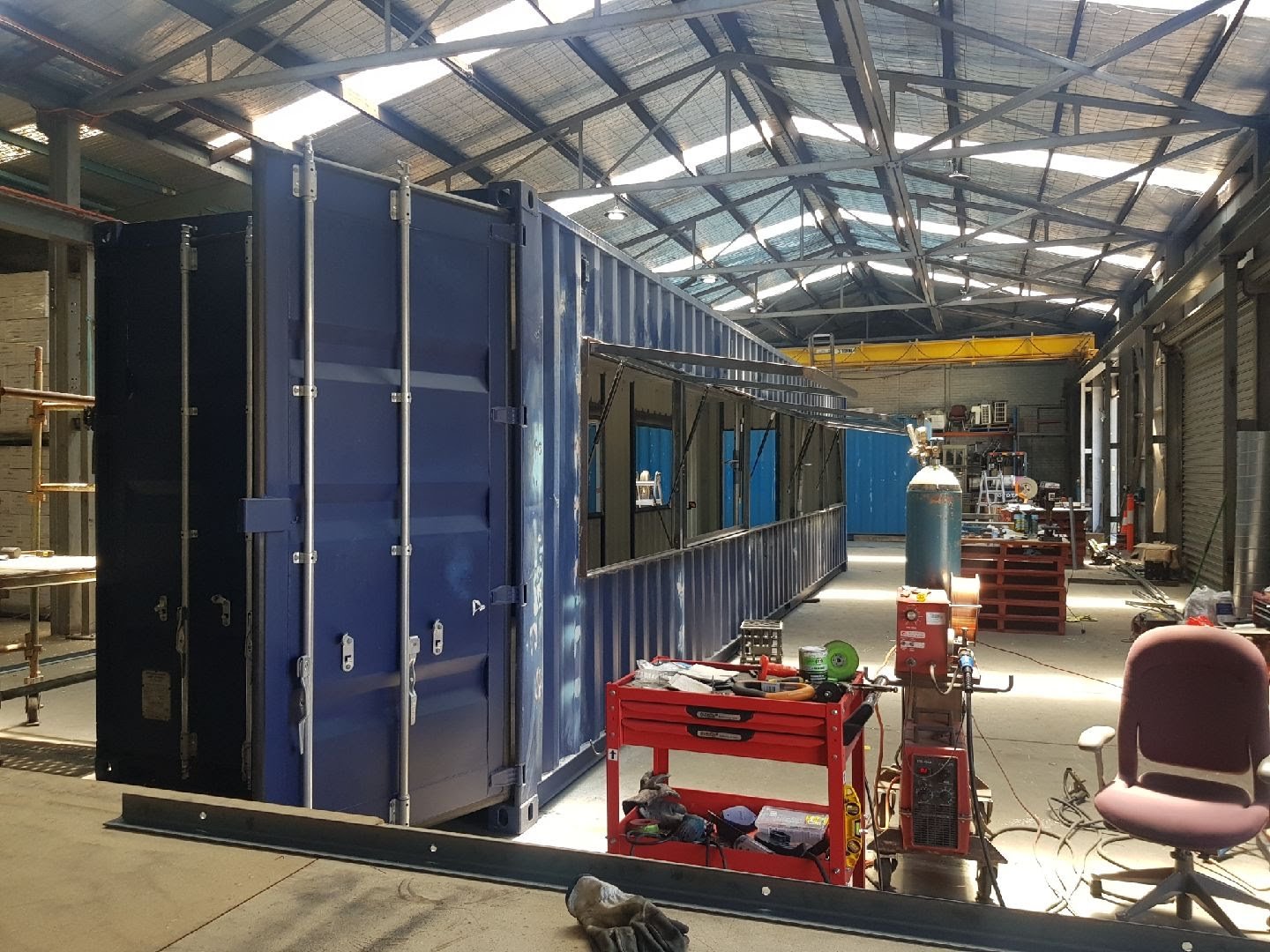 Shipping container unit being fabricated in the workshop